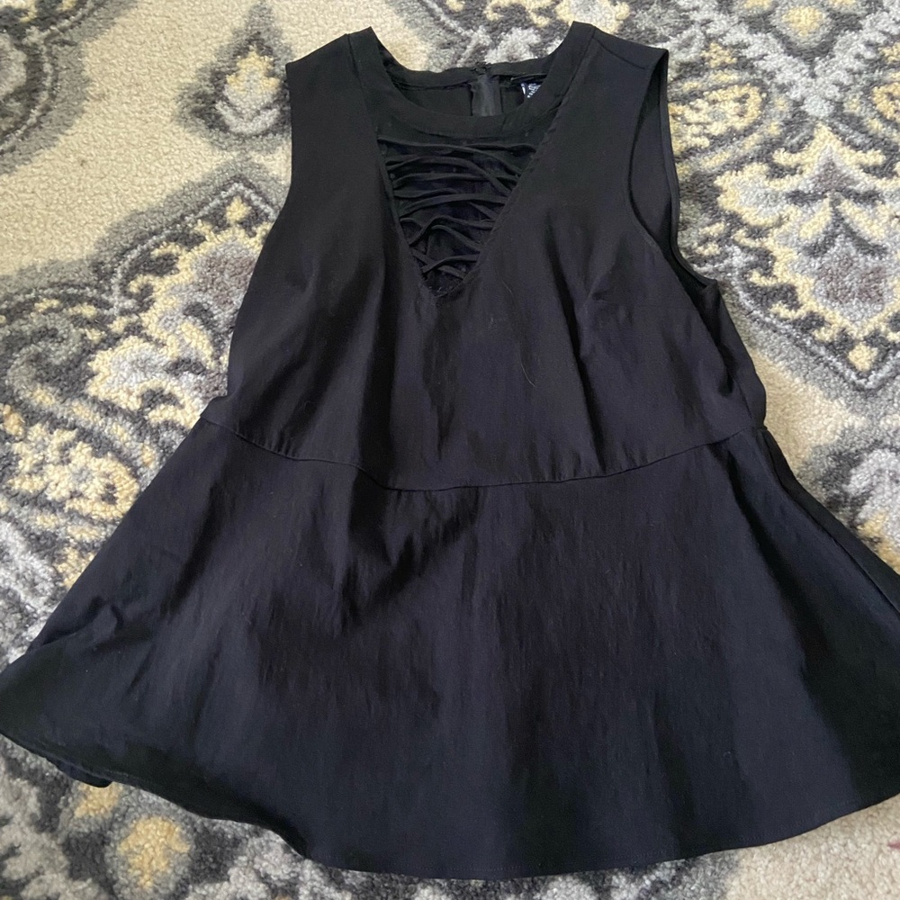 Gently used all black peplum top from Torrid size 1